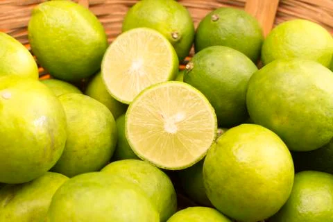 Group of Lemons in a Basket. Stock Photos