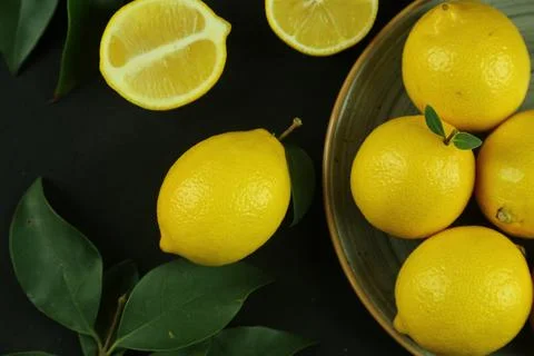 Group of lemons with leaves, isolated on background Stock Photos