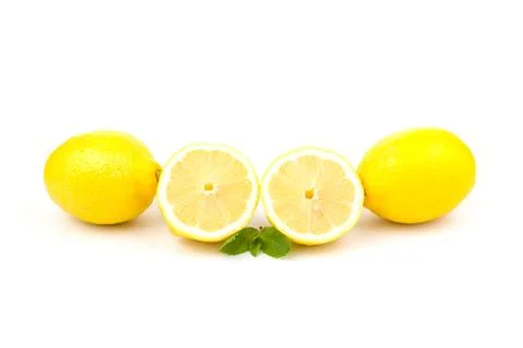 Group of lemons with mint leaves, isolated on white background Stock Photos