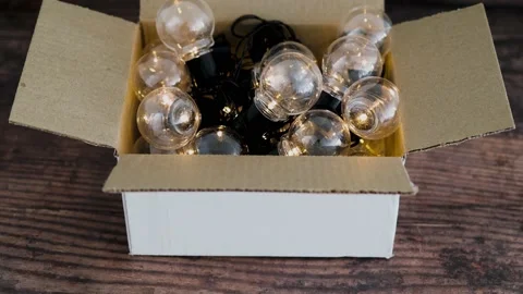 Group of light bulbs shining from an open box, mindset and thinking outside t Stock Footage 148513623