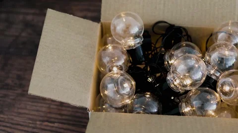 Group of light bulbs shining from an open box, mindset and thinking outside t Stock Footage 148513632