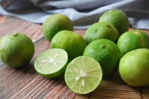 Group of lime with wooden texture background Stock Photos