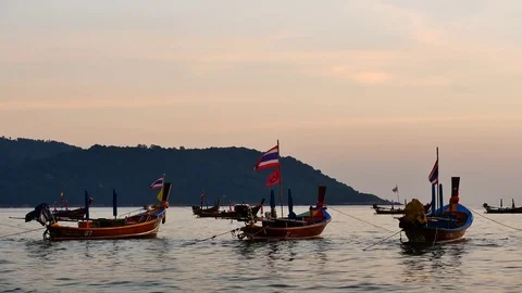 Group of  long tail boat converted to boat excursions floating in the andaman Stock Footage 83473974