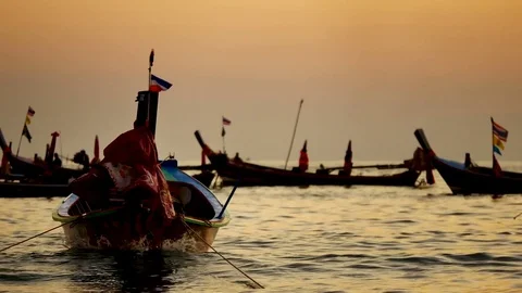 Group of  long tail boat converted to boat excursions floating in the andaman Stock Footage 84130661