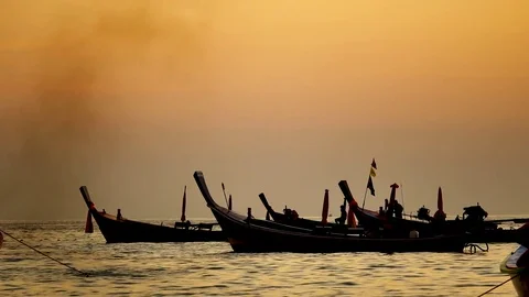 Group of  long tail boat converted to boat excursions floating in the andaman Stock Footage 84130666