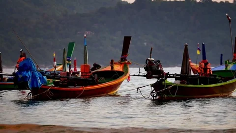 Group of  long tail boat converted to boat excursions floating in the andaman Stock Footage 84130674