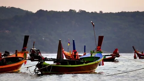 Group of  long tail boat converted to boat excursions floating in the andaman Stock Footage 84130685