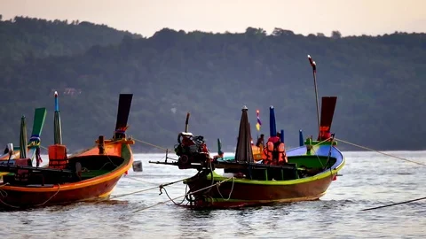 Group of  long tail boat converted to boat excursions floating in the andaman Stock Footage 84130707
