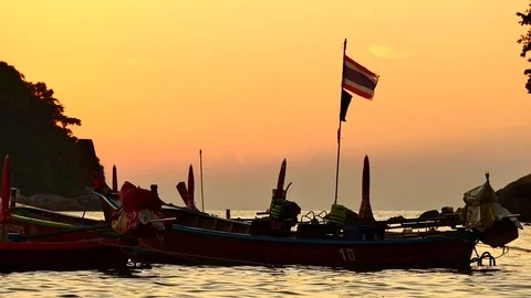 Group of  long tail boat converted to boat excursions floating in the andaman Stock Footage 84130730