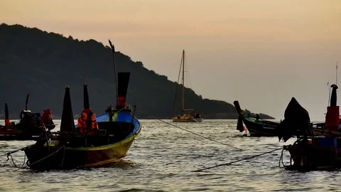 Group of  long tail boat converted to boat excursions floating in the andaman Stock Footage 84130744