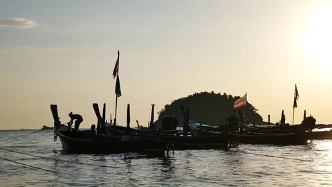 Group of long tail  boat with sunset at beach in phuket thailand. Видео 73617554