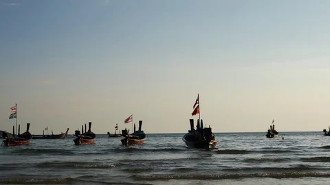 Group of long tail  boat with sunset at beach in phuket thailand. Stock Footage 73617575
