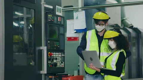 Group Machine engineer wear mask and face shield while working in industrial Stock Footage 146826004