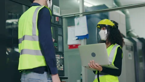 Group Machine engineer wear mask and face shield while working in industrial Stock Footage 146826405