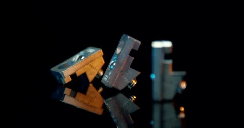 Group of machined metal brackets posing on a reflective dark surface Vídeo Stock 331433508