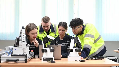Group of maintenance engineers working with robot maintenance Stock Footage 241519770