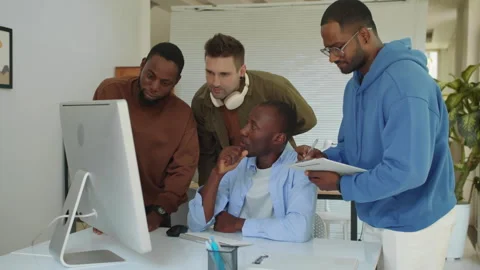 Group of Male Developers Discussing Code for Applications Stock Footage 277412732