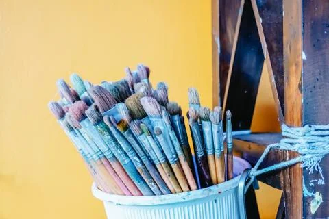Group of many different old brushes, paints and brushes. Stock Photos