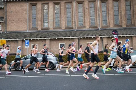 Group Of Marathon Runner Seen From The Side At The TCS Amsterdam Marathon A.. Stock Photos