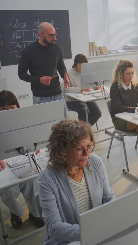 Group of Mature Students Study Together in Bright Modern Computer Classroom Stock Footage 321253288