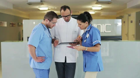 Group of medical workers consulting something in hospital Stockbeeldmateriaal 34661052