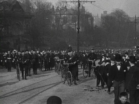 Group of men and troops in uniform marching in streets, United Kingdom, 1900 Stock Footage 132021675