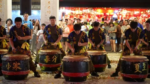 A group of men are playing 24 season drums Stock Footage 318097696