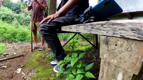 A group of men are sharing drinks from plastic bottles Video stock 278960412
