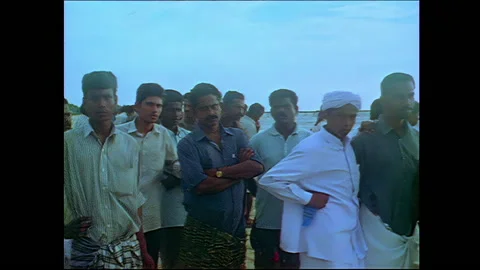 Group of men at beach by Indian Ocean Video stock 240055723