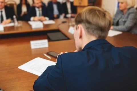 Group of men in business suits talking and discussing at conference, politi.. Stock Photos