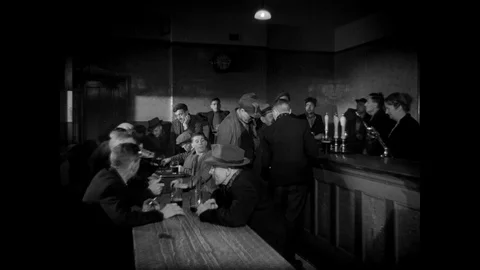 Group of men drinking beer and chatting in pub, South Wales, UK 1943 Stock Footage 133280011