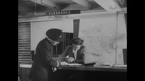 Group of men looking at map and talking, United Kingdom, 1949 Stock Footage 133386672
