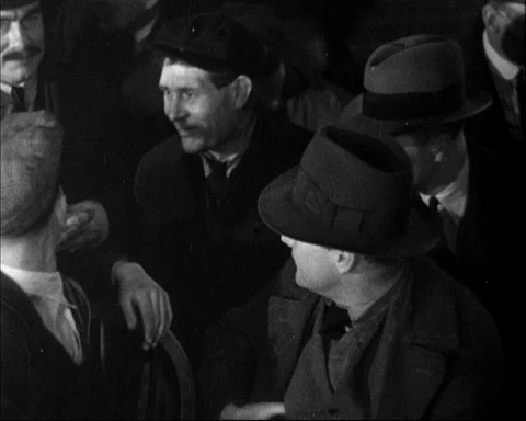 Group of men in office talking to each other and waiting, Britain, 1946 Stock Footage 141042404