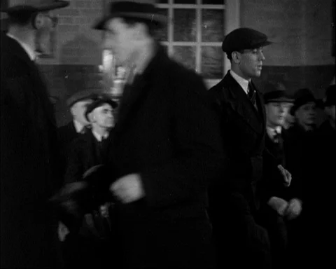 Group of men in office talking to each other and waiting, Britain, 1946 Stock Footage 141044113
