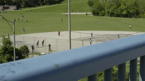 Group of men playing cricket in the park. 4K UHD. Stock Footage 51136707