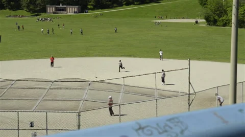 Group of men playing cricket in the park. 4K UHD. 動画素材 51137850