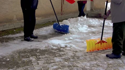 A group of men removes snow. Stock Footage 231430328