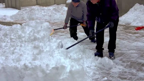 A group of men removes snow. Stock Footage 231430329
