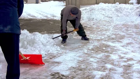A group of men removes snow. Stock Footage 231430330