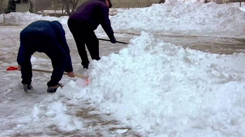 A group of men removes snow. Stock Footage 231430354