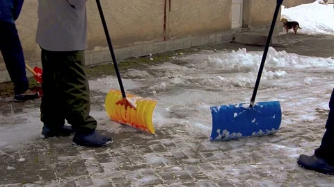 A group of men removes snow. Stock Footage 231430395