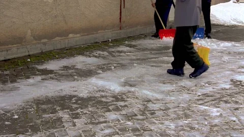 A group of men removes snow. Stock Footage 231430396