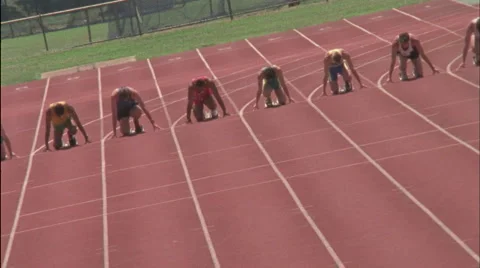 A group of men run a race. Stockbeeldmateriaal 5090659