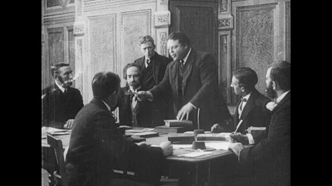 Group of men sitting at table and arguing, United Kingdom, 1913 Video stock 136680610