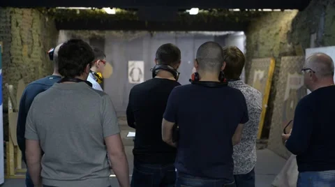 A group of men standing on a shooting range Видео 62634433