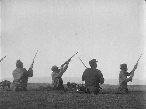 A group of  men wait hunt flying Geese - 1914 Stock Footage 95816061