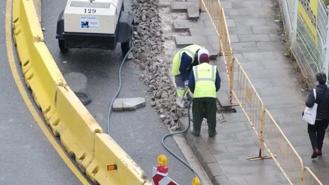 Group of men workers industrial machinery paving the road  in the public street Stock Footage 172542810