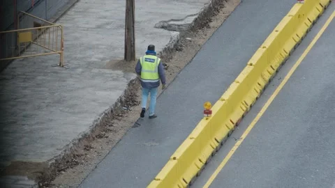 Group of men workers industrial machinery paving the road  in the public street Stock Footage 172542893