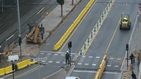 Group of men workers industrial machinery paving the road  in the public street Stock Footage 172542920