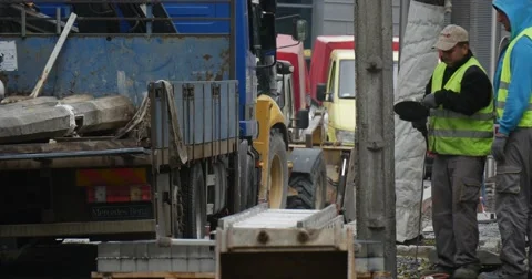 Group of Men Workers in Workwear Are Loading The Lorry Truck with Equipment Stock Footage 54337251